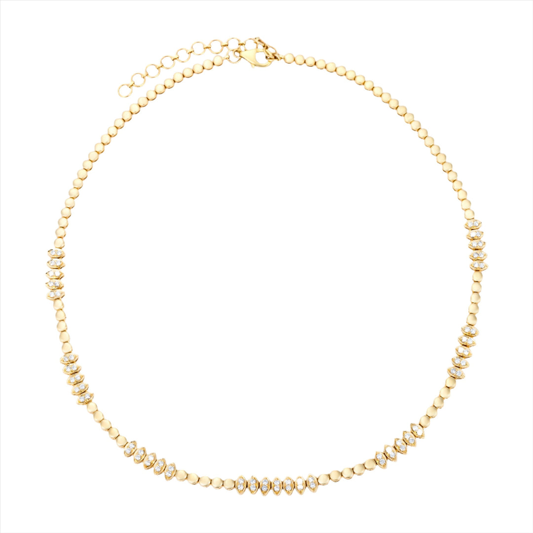 Chic 14K yellow gold necklace featuring 1.24ct of round diamonds arranged in an illusion setting to form marquis shapes, with an adjustable length from 16 to 18 inches.