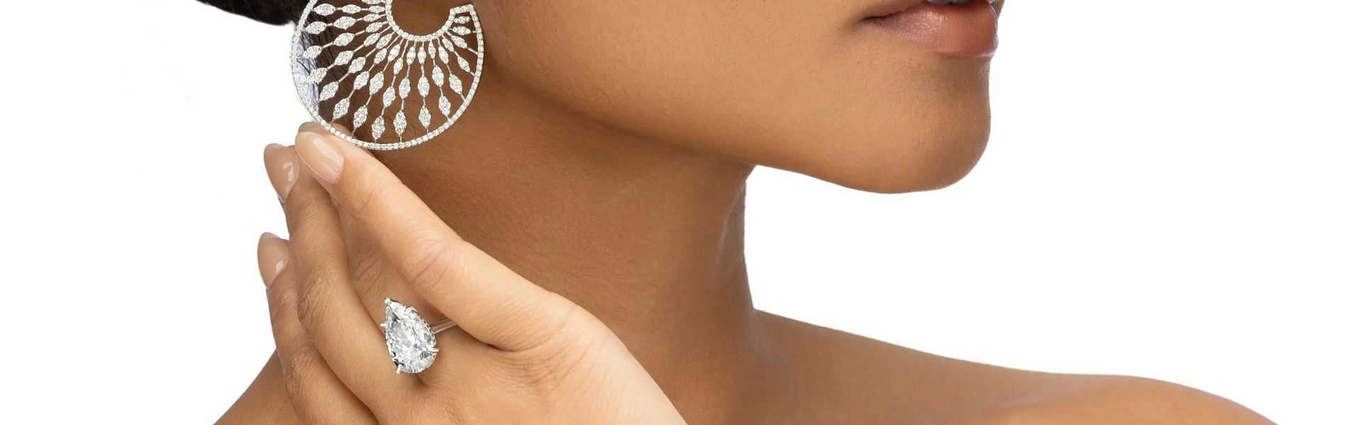 Statement diamond earrings and pear diamond ring luxury fine jewelry collection by Elyzian Jewelry.