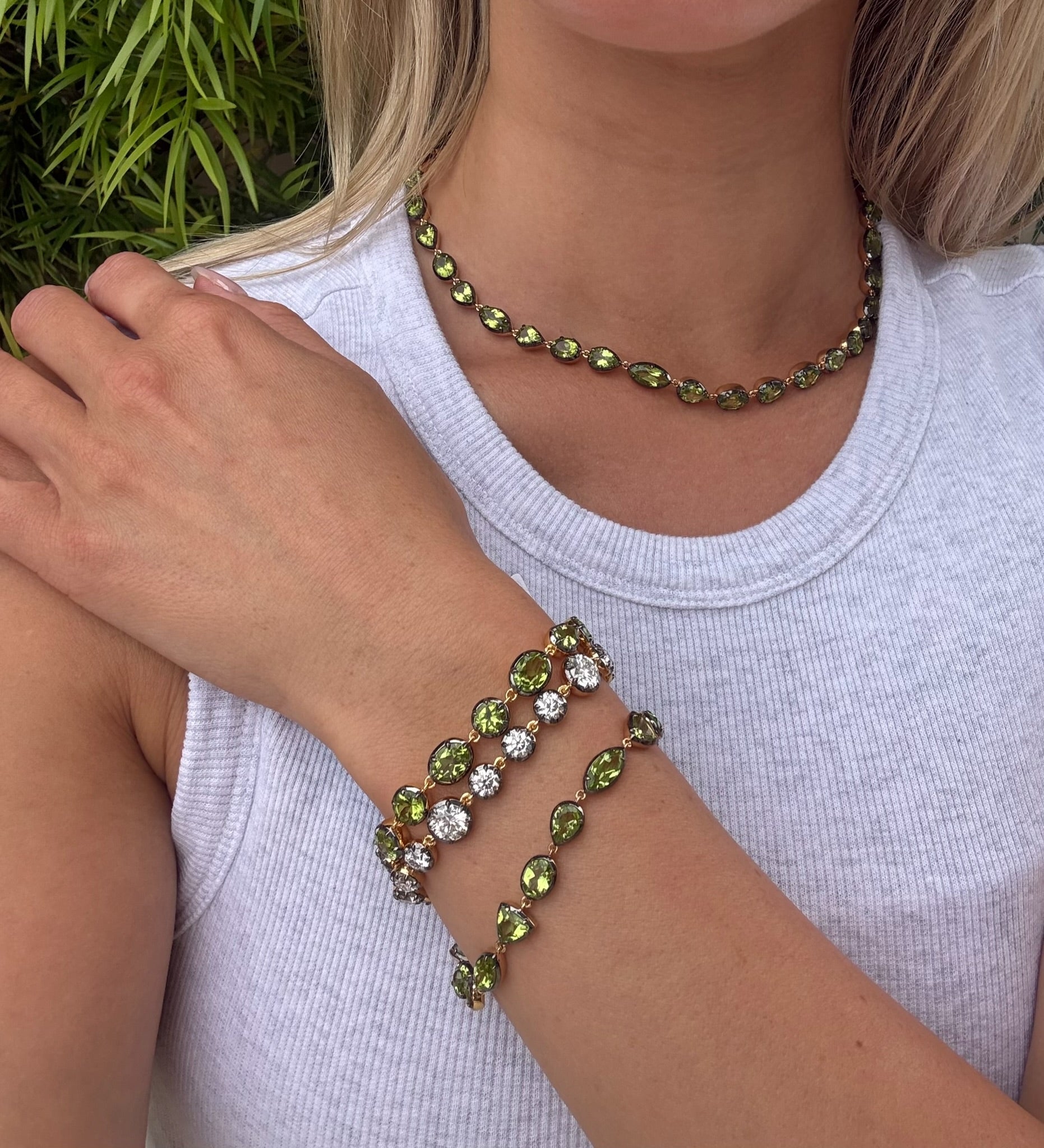 Elyzian Mixed shape peridot necklace, oval and round peridot bracelet, moissanite bracelet, and oval and pear cut bracelet. 