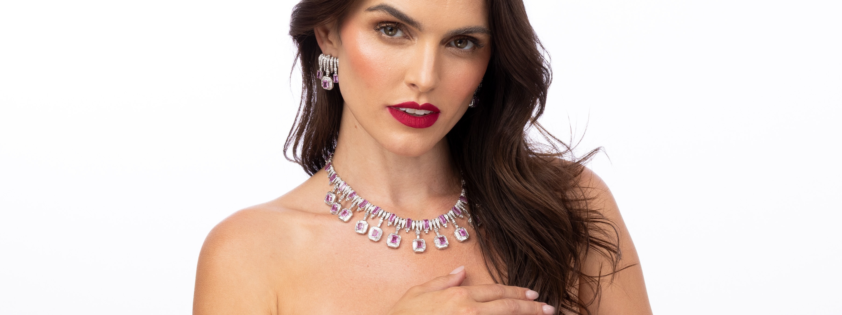 Elyzian pink sapphire and gold layered necklaces golden hour, vibrant gemstone luxury fine jewelry styling