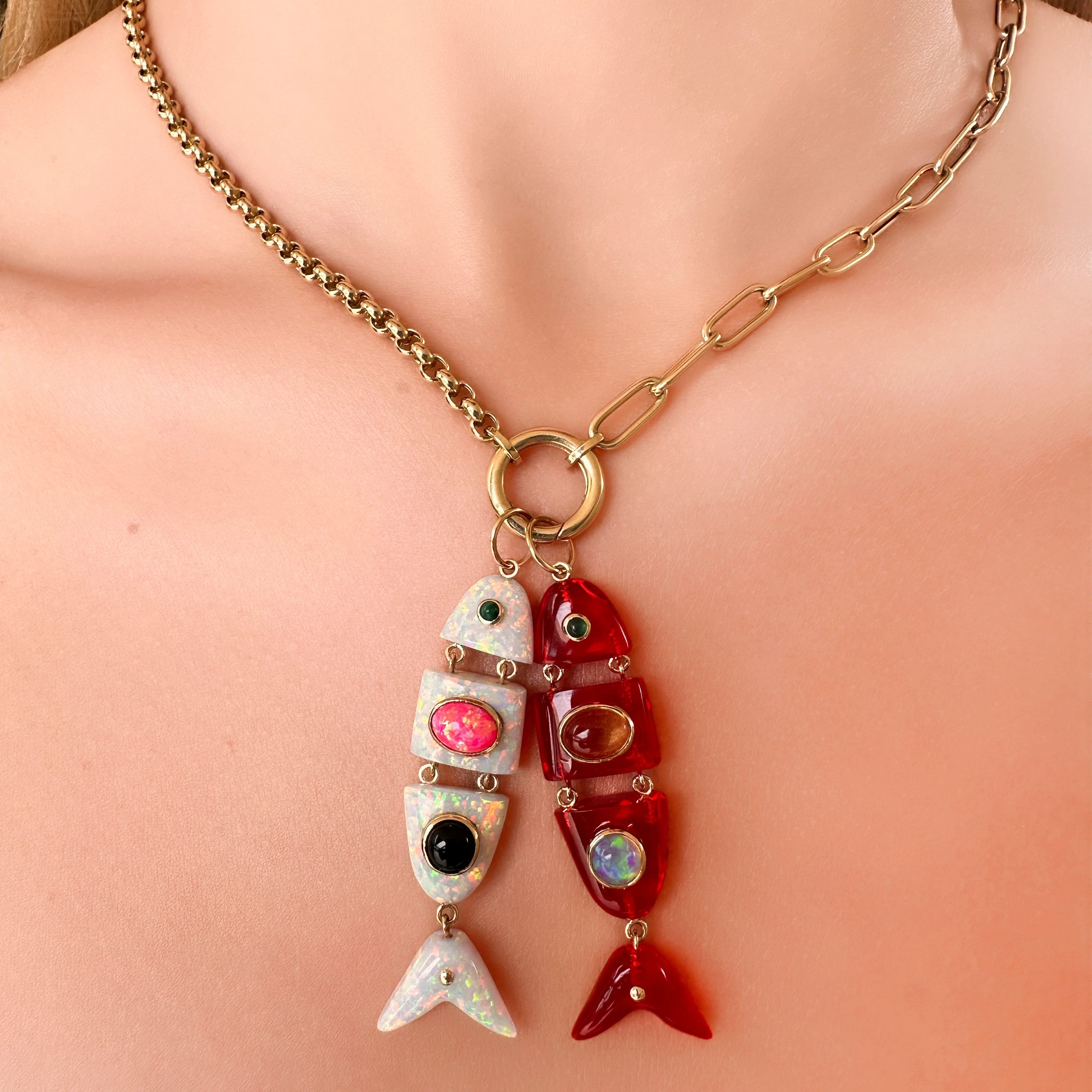 Necklace with colorful fish pendants on a person's neck