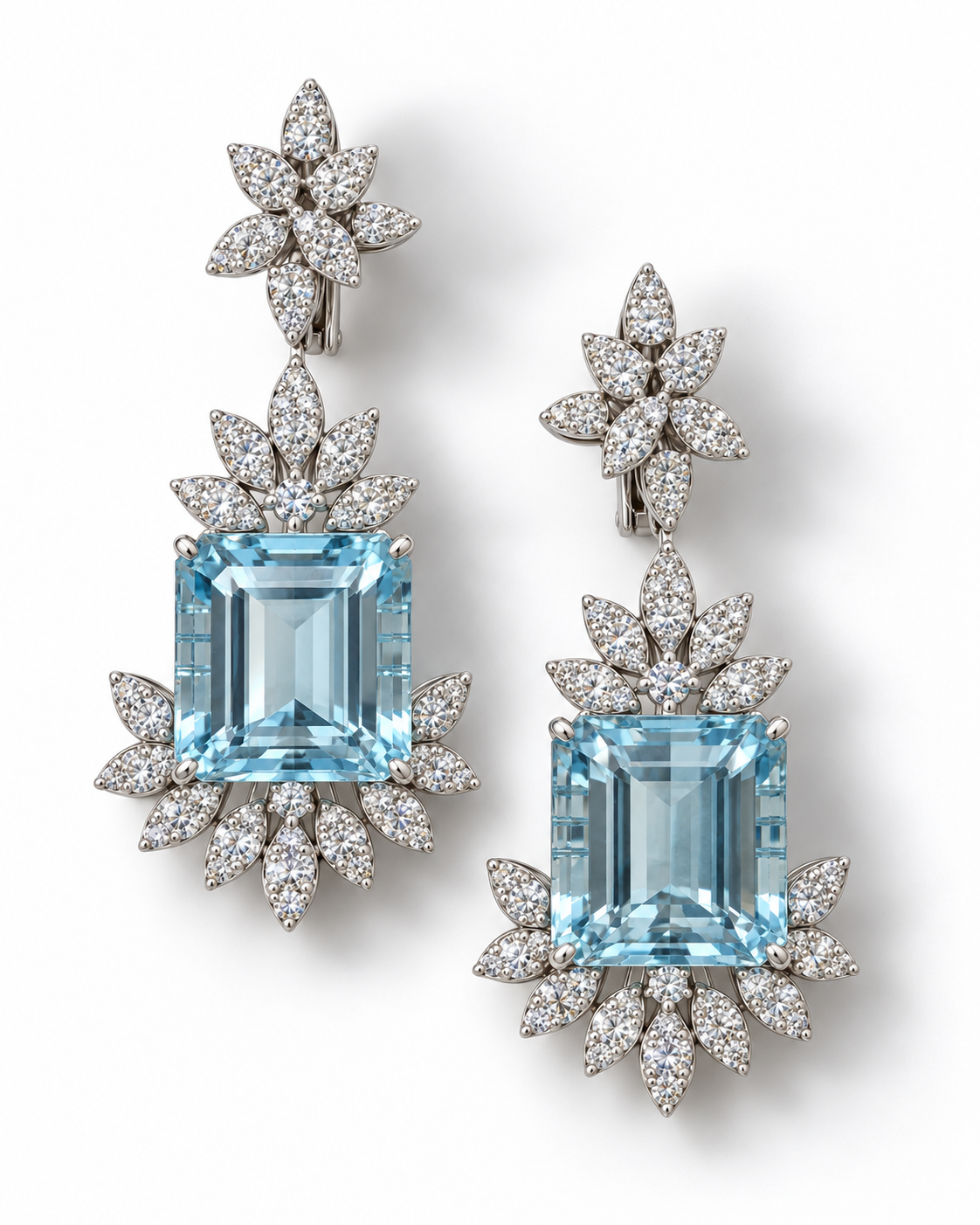 Elyzian emerald-cut aquamarine and diamond drop earrings in 18K white gold, with diamond-set leaf surrounds and floral tops, on a white background.