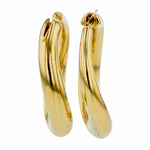 Elegant 14K yellow gold large curved round hoop earrings featuring a stylish silhouette and lightweight design, perfect for everyday wear and timeless sophistication.