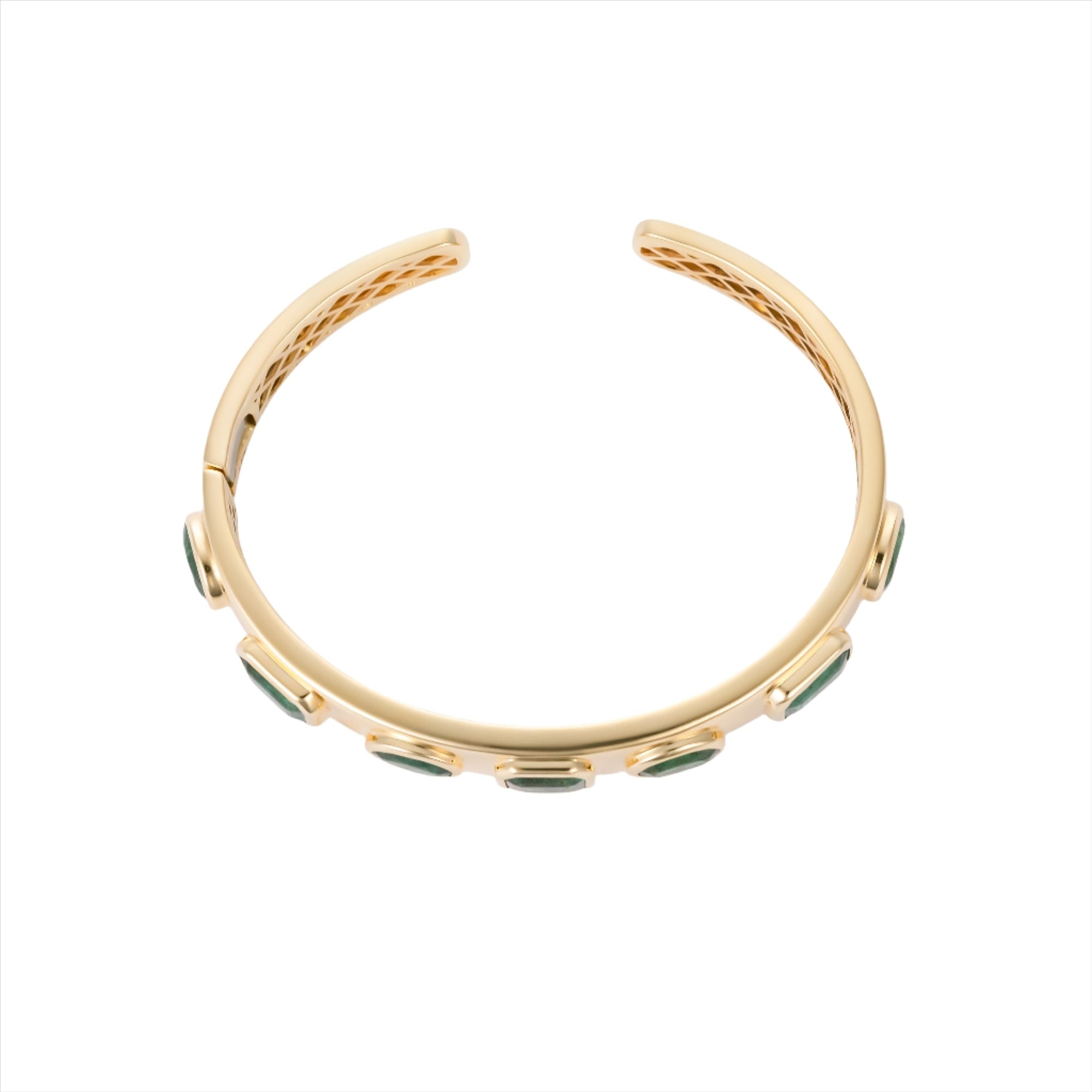 Exquisite 14K yellow gold bangle featuring seven bezel-set emeralds in mixed shapes totaling 10 carats, creating a bold yet refined statement of elegance and color.