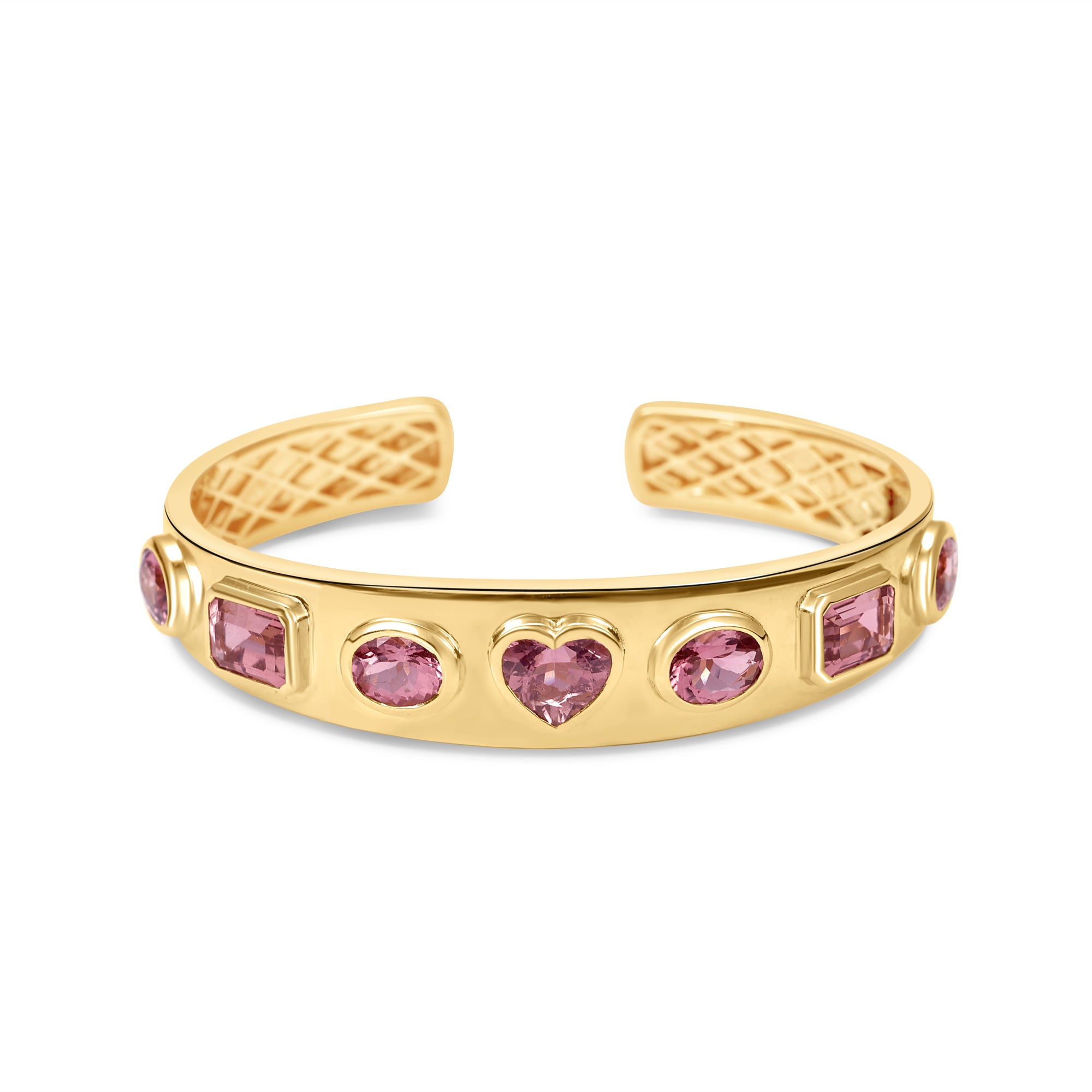 Exquisite 14K yellow gold bangle featuring seven mixed-shape pink tourmalines, including oval, cushion, and heart shapes, blending sophistication with playful charm for a luxurious statement piece. Font and detail of inside. 