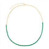 Elegant 14K yellow gold tennis necklace featuring 7.04ct of vibrant emeralds in a classic design, with an adjustable length from 15 to 18 inches for a versatile, refined fit.