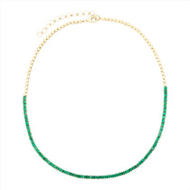 Elegant 14K yellow gold tennis necklace featuring 7.04ct of vibrant emeralds in a classic design, with an adjustable length from 15 to 18 inches for a versatile, refined fit.