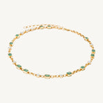 Handmade 14K yellow gold adjustable rolo chain necklace featuring 13 bezel-set emerald cut Zambian emeralds (6.12ct) and 10 bezel-set solitaire diamonds (1.74ct), offering refined elegance with a bold touch.