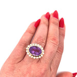 Stunning 14K yellow gold cocktail ring featuring an 8.65ct amethyst center stone surrounded by a sparkling diamond halo in an elegant basket setting, perfect for bold gemstone lovers.