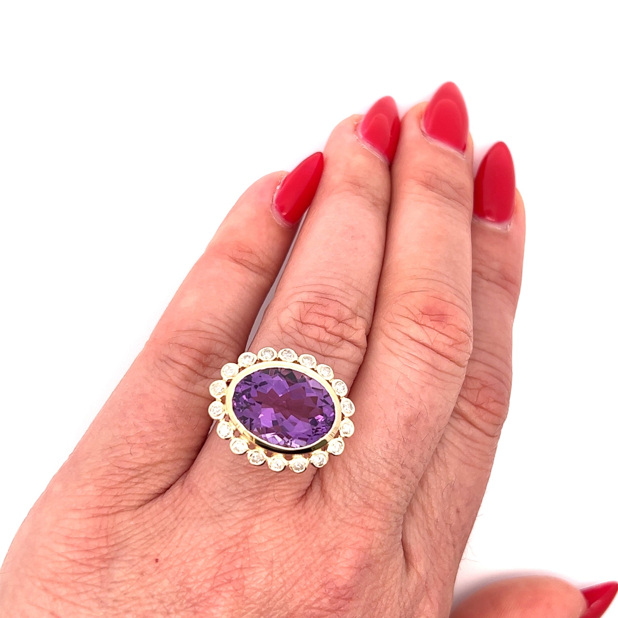 Stunning 14K yellow gold cocktail ring featuring an 8.65ct amethyst center stone surrounded by a sparkling diamond halo in an elegant basket setting, perfect for bold gemstone lovers.