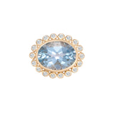 Stunning 14K yellow gold anemone cocktail ring featuring a central aquamarine framed by a delicate diamond halo, with an elegant basket setting for added luxury.