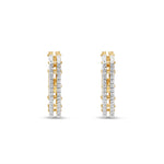 Bold 14K yellow gold hexagon hoop earrings featuring stunning diamond accents, offering a unique architectural design that makes a standout statement. Close up front view