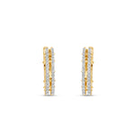 Bold 14K yellow gold hexagon hoop earrings featuring stunning diamond accents, offering a unique architectural design that makes a standout statement. Front view
