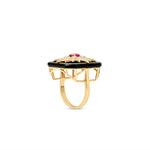 Celestial Art Deco starburst ring featuring a radiant ruby centerpiece framed by a bold onyx setting and intricate diamond accents, all set in 14K yellow gold for a dazzling vintage statement. Side view.
