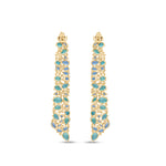 Stunning Aurora earrings crafted in 14K yellow gold, featuring vibrant emeralds, sparkling blue topaz, and shimmering diamonds, inspired by the ocean’s hues and cascading with unmatched brilliance. Back detail. 