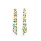 Stunning Aurora earrings crafted in 14K yellow gold, featuring vibrant emeralds, sparkling blue topaz, and shimmering diamonds, inspired by the ocean’s hues and cascading with unmatched brilliance. Back detail. 