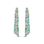 Stunning Aurora earrings crafted in 14K yellow gold, featuring vibrant emeralds, sparkling blue topaz, and shimmering diamonds, inspired by the ocean’s hues and cascading with unmatched brilliance. Front close up of the front.