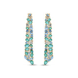 Stunning Aurora earrings crafted in 14K yellow gold, featuring vibrant emeralds, sparkling blue topaz, and shimmering diamonds, inspired by the ocean’s hues and cascading with unmatched brilliance. Front close up of the front.