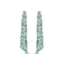 Stunning Aurora earrings crafted in 14K yellow gold, featuring vibrant emeralds, sparkling blue topaz, and shimmering diamonds, inspired by the ocean’s hues and cascading with unmatched brilliance. Front close up of the front.