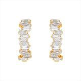 Modern 14K yellow gold huggie earrings featuring a staggered stack design with 26 baguette-cut G-H VS diamonds per hoop (1.16ct total), secured with a lever back closure—perfect for everyday elegance.