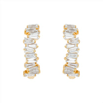 Modern 14K yellow gold huggie earrings featuring a staggered stack design with 26 baguette-cut G-H VS diamonds per hoop (1.16ct total), secured with a lever back closure—perfect for everyday elegance.