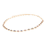 Stunning adjustable 14K yellow gold necklace featuring a unique arrangement of mixed-shaped bezel-set pastel sapphires, adding a light touch of color and elegance to any ensemble. Close up side angle. 
