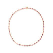 Romantic yellow gold tennis necklace featuring bezel-set oval-shaped pink sapphires and sparkling diamonds, offering a delicate yet luxurious design perfect for special occasions.