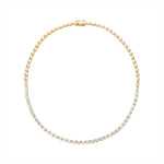 Luxurious 14K yellow gold bead necklace featuring 12 carats of bezel-set elongated emerald cut diamonds (VVS clarity, G-H color) in a refined 16-inch silhouette for a bold and elegant look.