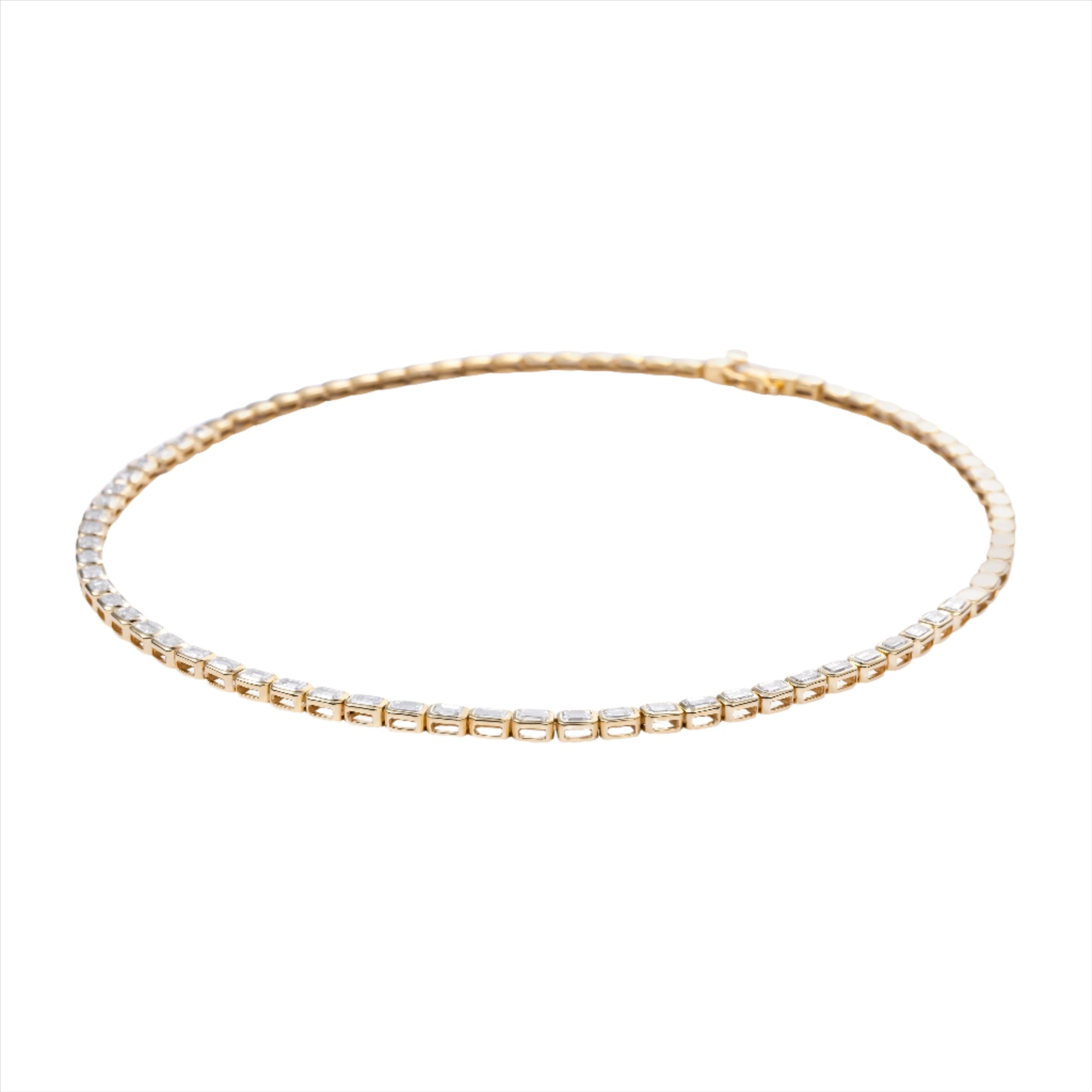 Luxurious 14K yellow gold bead necklace featuring 12 carats of bezel-set elongated emerald cut diamonds (VVS clarity, G-H color) in a refined 16-inch silhouette for a bold and elegant look.