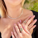 Refined 14K yellow gold necklace featuring an emerald-cut bezel-set white sapphire, accented with gold beads in a sleek 16.5-inch design for timeless elegance.