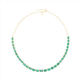 Adjustable 14K yellow gold necklace featuring 38.87 carats of natural, unheated Zambian emeralds in bezel settings, with the largest stone measuring 8.4mm x 6.1mm, offering vibrant green luxury and timeless elegance.
