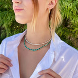 Adjustable 14K yellow gold necklace featuring 38.87 carats of natural, unheated Zambian emeralds in bezel settings, with the largest stone measuring 8.4mm x 6.1mm, offering vibrant green luxury and timeless elegance.