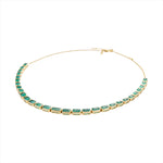 Adjustable 14K yellow gold necklace featuring 38.87 carats of natural, unheated Zambian emeralds in bezel settings, with the largest stone measuring 8.4mm x 6.1mm, offering vibrant green luxury and timeless elegance.