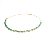 Adjustable 14K yellow gold necklace featuring 38.87 carats of natural, unheated Zambian emeralds in bezel settings, with the largest stone measuring 8.4mm x 6.1mm, offering vibrant green luxury and timeless elegance.