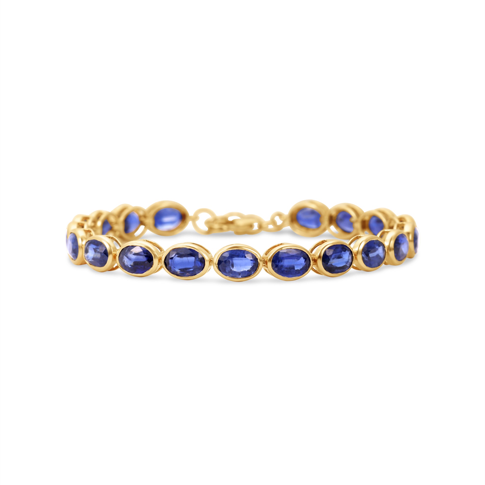 Luxurious 14K gold tennis bracelet featuring bezel-set oval-cut blue sapphires, exuding timeless elegance and vibrant sophistication.