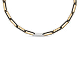 old black diamond paperclip chain necklace featuring sleek 14K yellow gold links, accented with black diamonds and a single white gold and diamond accent link, embodying modern luxury. Close up. 