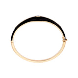 Art Deco-inspired bangle in 14K yellow gold, featuring sleek black enamel detailing and 0.48ct of sparkling diamonds. Total weight: 14.45g—an elegant blend of vintage glamour and modern edge.