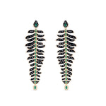 One-of-a-kind 14K yellow gold feather earrings featuring black onyx, emeralds, and diamonds, uniquely designed for versatility—wear as dramatic dangle earrings or convert into a striking feather bracelet paired with emerald studs. Shown as earrings. 