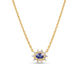 Exquisite anemone flower necklace featuring a stunning oval-cut blue sapphire at the center, surrounded by ten pear-shaped diamonds in a captivating floral design, crafted in elegant gold. Close up of front view. 
