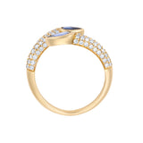 Elegant 14K yellow gold serpent-style bypass ring featuring two bezel-set pear-cut blue sapphires (0.735ct) and 0.482ct of G-H VS pavé diamonds, offering a bold and refined silhouette.