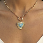 Heart-shaped pendant blue topaz, diamonds and 14k gold on body