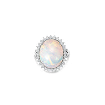  18K white gold ring features a mesmerizing cabochon white opal, beautifully framed by a halo of modified prong-set diamonds front facing