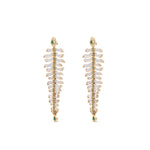 One-of-a-kind 14K yellow gold feather earrings featuring clear rock quartz, emeralds, and sparkling diamonds, designed for versatility—wear them as statement dangle earrings or transform the detachable feathers into a unique bracelet complemented by emerald stud earrings. Front close up as earrings. 