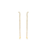 Meticulously crafted 14K yellow gold convertible earrings featuring round bezel-set diamonds in a loop design, offering versatility to be worn as classic loop earrings or sleek linear drop earrings for any occasion. Opened to drop earrings. 