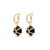 Bold Art Deco-inspired hexagonal earrings crafted in 14K yellow gold, featuring striking black onyx, a vibrant 1.0ct ruby center, and 0.53ct of sparkling diamond accents for timeless sophistication.