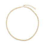 Graceful 14K yellow gold slinky necklace featuring delicately set diamond accents, offering understated luxury with a smooth, flowing design—perfect for layering or wearing alone.