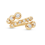 Stunning 14K yellow gold wrap ring featuring delicate bezel-set diamond bubbles, enhancing brilliance and creating a versatile, elegant accent for any occasion. Close up. 