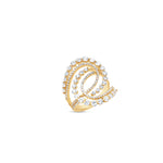 Stunning cosmic swirl ring crafted in 14K yellow gold, featuring graduated and tapered diamonds set in interlocking loops, combining luxury, craftsmanship, and timeless sophistication. Close up.