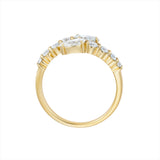 Elegant 14K yellow gold bypass ring featuring 1.2ct of G-H VS diamonds, including pear-shaped ends and graduated solitaires, creating a radiant flurry effect with a graceful silhouette.