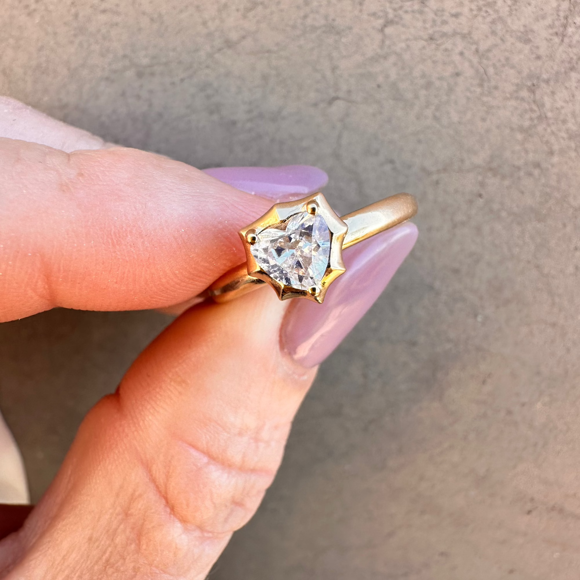 Modern deco 14K yellow gold ring featuring a 0.54ct G-H VS heart-shaped diamond in a sleek prong setting, blending vintage romance with bold contemporary style.